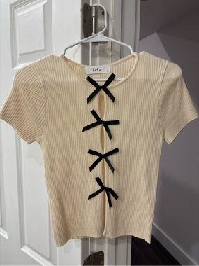 Lele Cream Ribbed Crop Top with Black Bow Trim